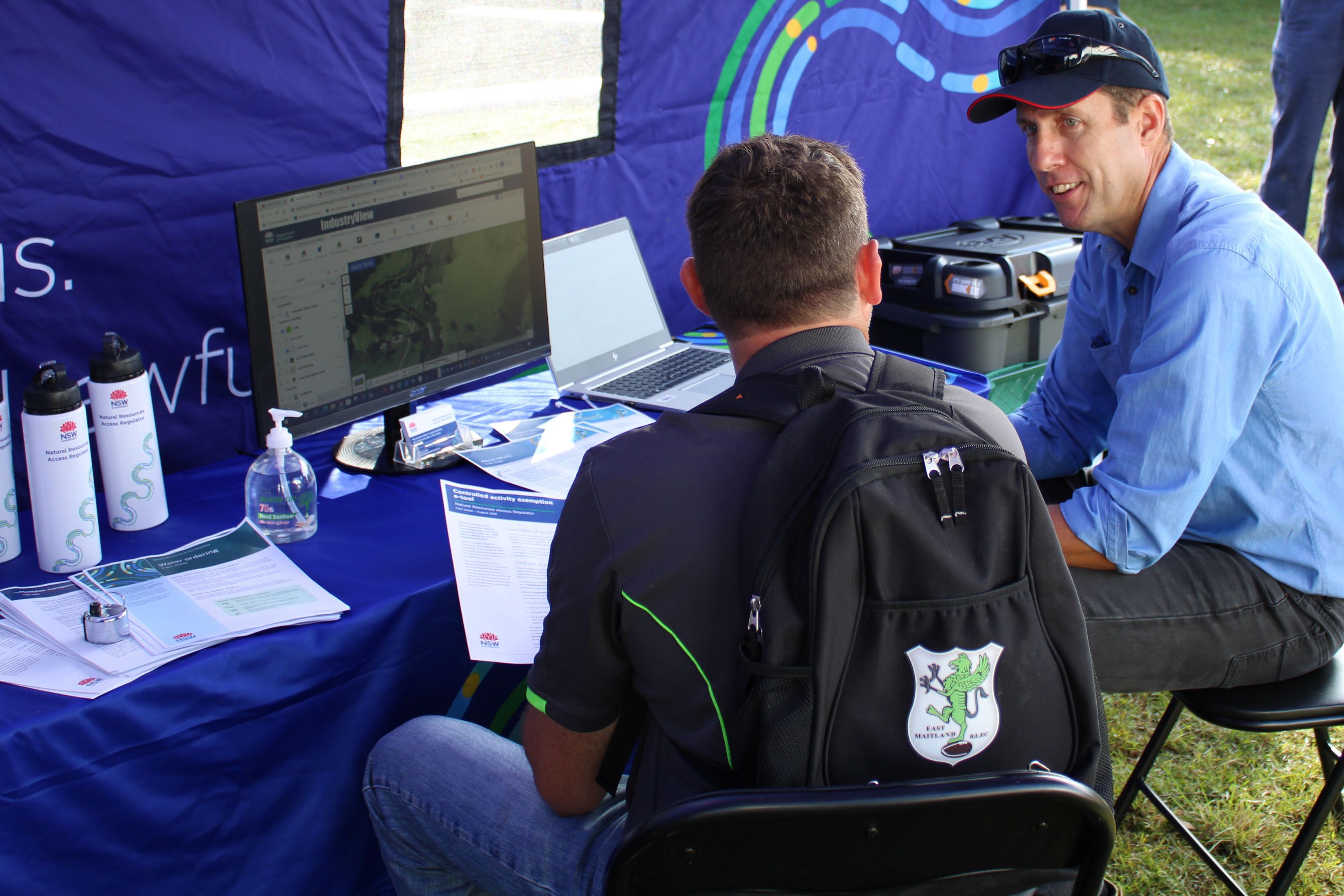 NRAR officer speaks to a water user at a field day