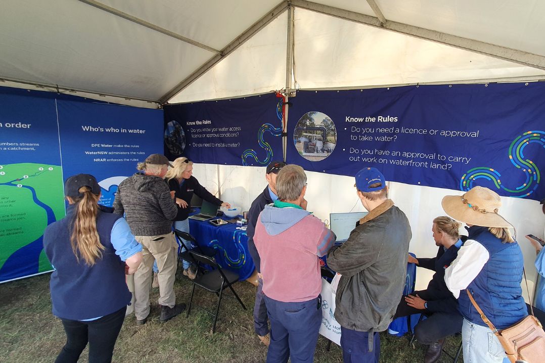 NRAR officers speak with water users at the NRAR site at a field day.